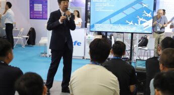 Chen Min explaining ADB SAFEGATE´s RWSL at the technology and service salon at inter airport Chona 2023